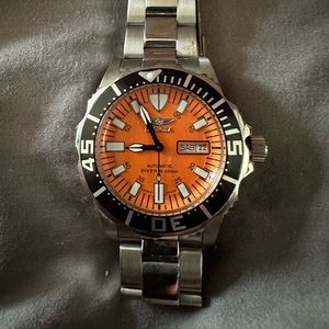 200 meter Invicta dive watch. No battery needed, perpetual motion.